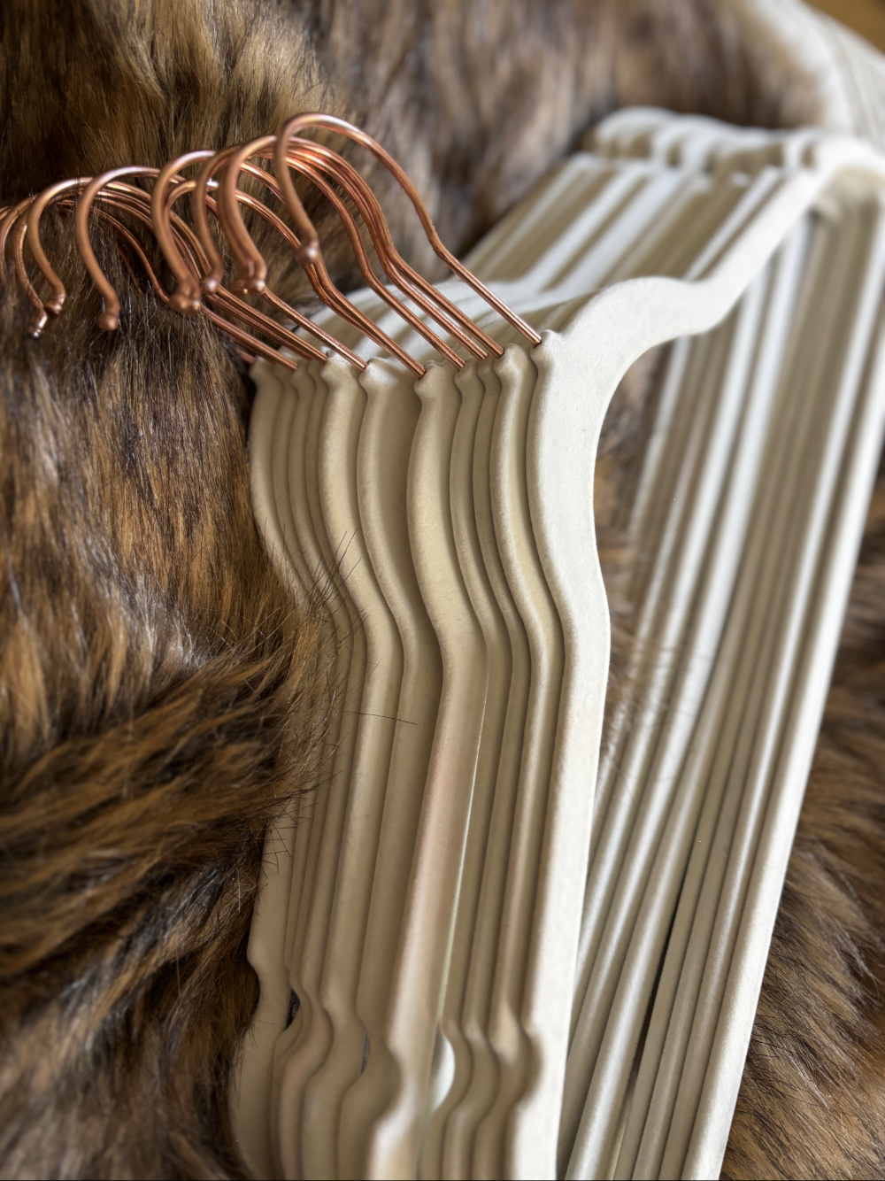 stack of ivory velvet clothes hangers