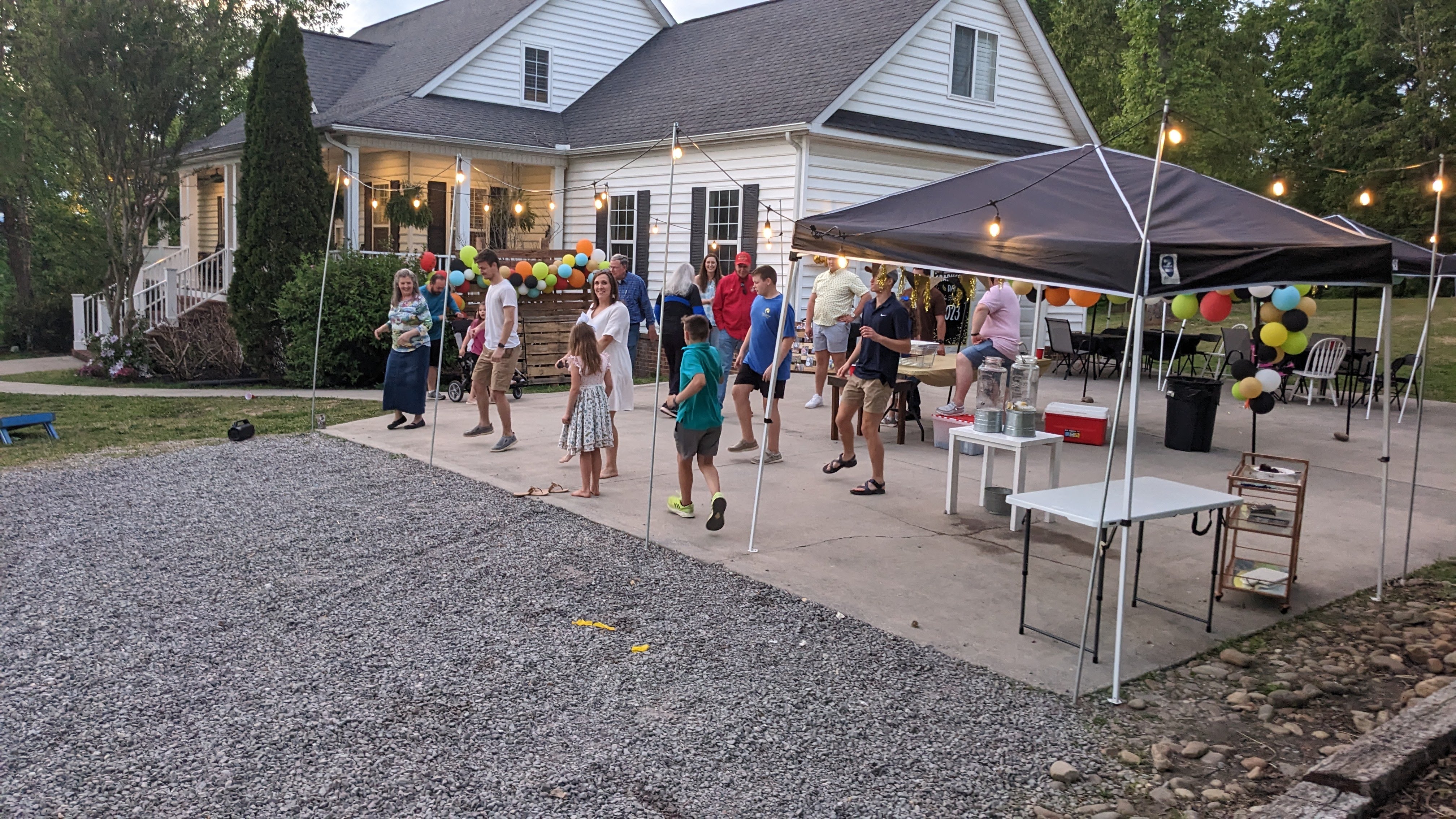 crowd at graduation party dancing to music